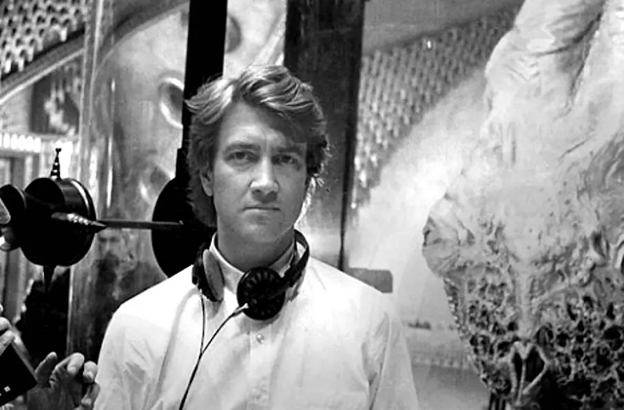 A younger David Lynch in the middle of directing.